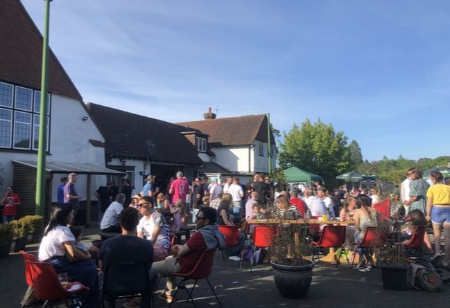 Festival-goers enjoy the sunshine outside at the Beacon Hill Beer Festival