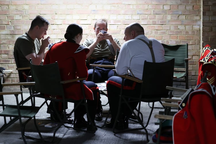 Image of military personnel, seen here at Wellington Barracks in London, before taking part in the King's Coronation.

The UK Armed Forces conduct their largest ceremonial operation for 70 years today (06/05/2023), and accompanied Their Majesties King Charles III and Queen Consort Camilla to the Coronation service at Westminster Abbey.

More than 7,000 soldiers, sailors and aviators from across the UK and Commonwealth participated in ceremonial activities across processions, fly pasts and gun salutes marking the historic event.

With around 200 personnel providing a Guard of Honour at Buckingham Palace, together this made up the largest UK military ceremonial operation for 70 years.

As well as marching detachments from across the Household Division, Royal Navy, British Army and Royal Air Force, more than 400 troops from the Commonwealth nations and British Overseas Territories were on parade, representing the diversity and traditions of Armed Forces around the globe with connections to His Majesty The King.

Foot Guards of the Household Division lined The Mall, the Royal Navy lined their spiritual home at Admiralty Arch, the Royal Marines at Trafalgar Square and the Royal Air Force Whitehall and Parliament Square.


