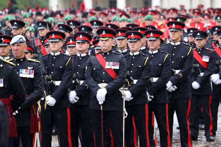 Image of military personnel, seen here at Wellington Barracks in London, before taking part in the King's Coronation.

The UK Armed Forces conduct their largest ceremonial operation for 70 years today (06/05/2023), and accompanied Their Majesties King Charles III and Queen Consort Camilla to the Coronation service at Westminster Abbey.

More than 7,000 soldiers, sailors and aviators from across the UK and Commonwealth participated in ceremonial activities across processions, fly pasts and gun salutes marking the historic event.

With around 200 personnel providing a Guard of Honour at Buckingham Palace, together this made up the largest UK military ceremonial operation for 70 years.

As well as marching detachments from across the Household Division, Royal Navy, British Army and Royal Air Force, more than 400 troops from the Commonwealth nations and British Overseas Territories were on parade, representing the diversity and traditions of Armed Forces around the globe with connections to His Majesty The King.

Foot Guards of the Household Division lined The Mall, the Royal Navy lined their spiritual home at Admiralty Arch, the Royal Marines at Trafalgar Square and the Royal Air Force Whitehall and Parliament Square.


