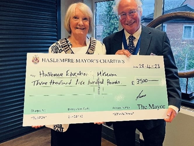 Haslemere's outgoing mayor Cllr Jacquie Keen hands over a cheque for £3,500 to Haslemere Educational Museum trustee Christopher Ashton-Jones