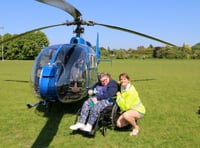 Disabled Woodlarks campers enjoy helicopter flights to Tilford