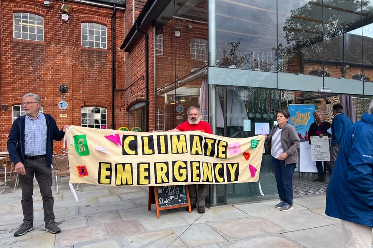 Extinction Rebellion protesters outside the Farnham Maltings ahead of Farnborough Airport's consultation drop-in