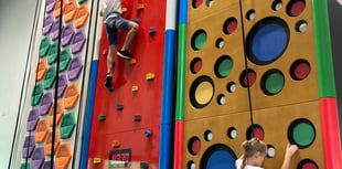 Ukrainian children go up the climbing wall at Alton Sports Centre