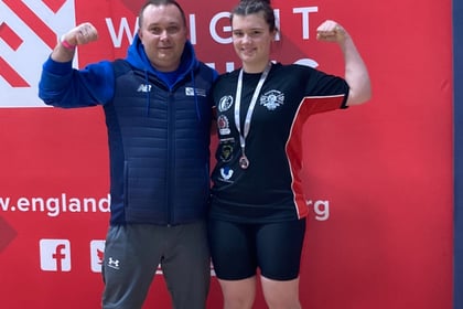 Rising weightlifting star wins silver thanks to community support