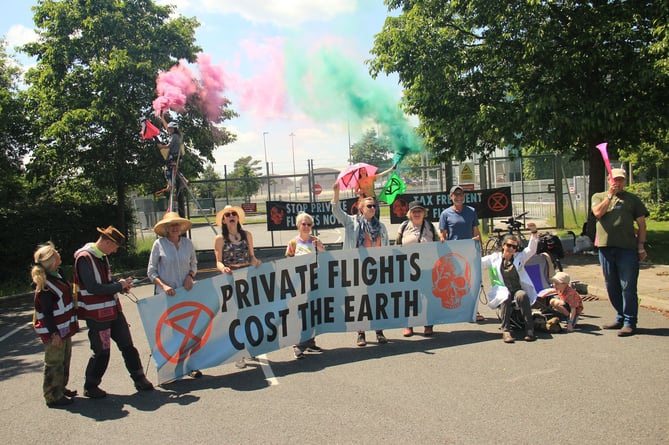 Protesters blocking one of the airport gates in a bid to ban private flights 
