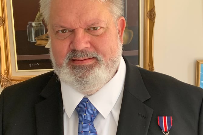 Haslemere lawyer, Bryan Boese, with his Coronation Medal 