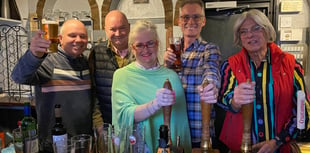 Glasses raised after villagers buy their local