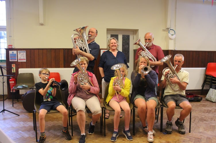 Haslemere Town Training Band members playing brass instruments