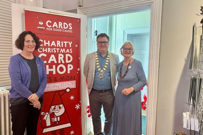 Town Clerk Lisa O'Sullivan, Mayor Oliver Leach, and manager of Haslemere's Cards for Good Causes, Maggie Monteath